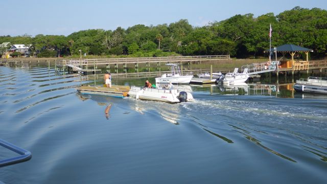 8.33am - dinghy pushing raft with wood and workers - 5-4-15