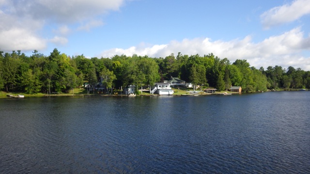 9.07am - boat shed and a plane!!  7-21-15