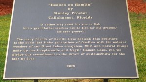 18.36 - 6.36pm - fishing bronze statue sign 8-30-15