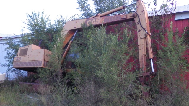 Weeds and ditch digger